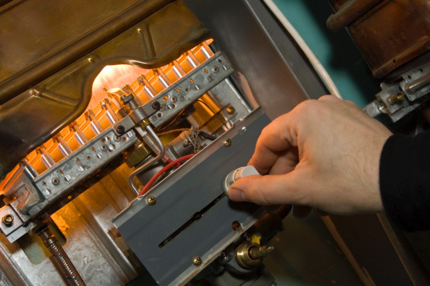 Close-up of a Hixon technician servicing a gas furnace in a Dacula, GA home
