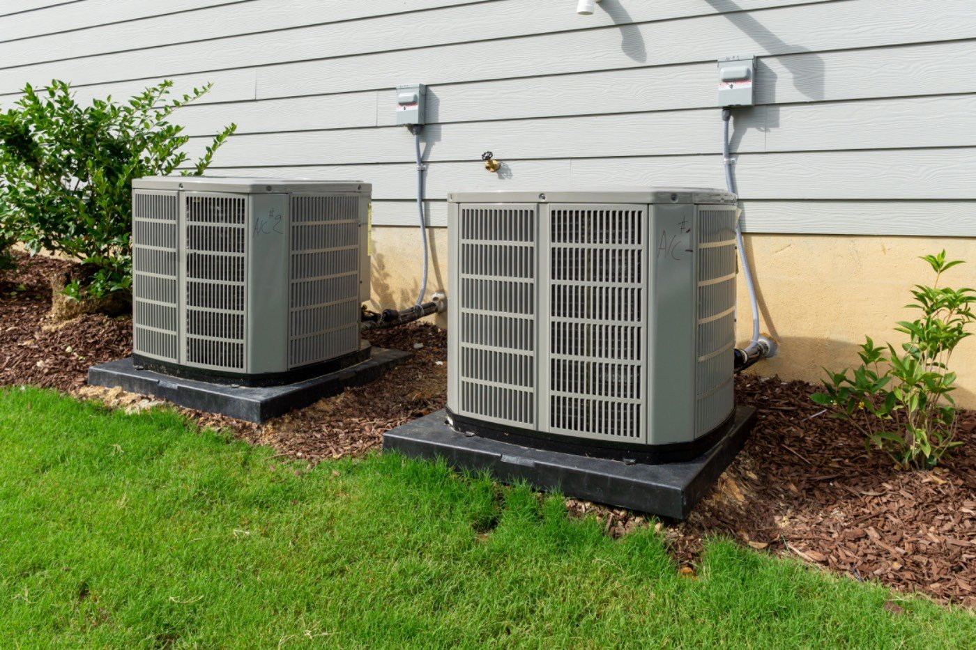 Residential air conditioning condenser units serviced by Hixon in Dacula, GA